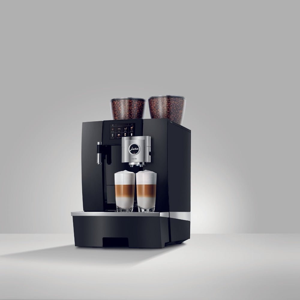 OBL2 Giga X8C Black coffee machine with two cups of coffee on a gray background