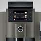Close-up detail of OBS1 coffee machine digital display and Jura logo on a gray background