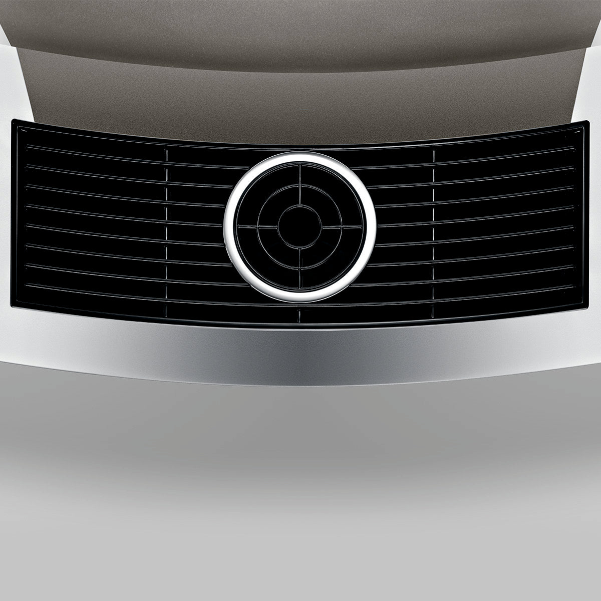 Close-up of OBM3  Jura X10 coffee machine front vent grille with silver circular ring on grey background