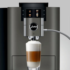 OBM3 Jura X10 spout dispensing a layered latte into a glass