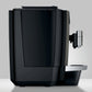 Left side view of OBM3  Jura X10 coffee machine with sleek black casing and milk spout, on a light gray background